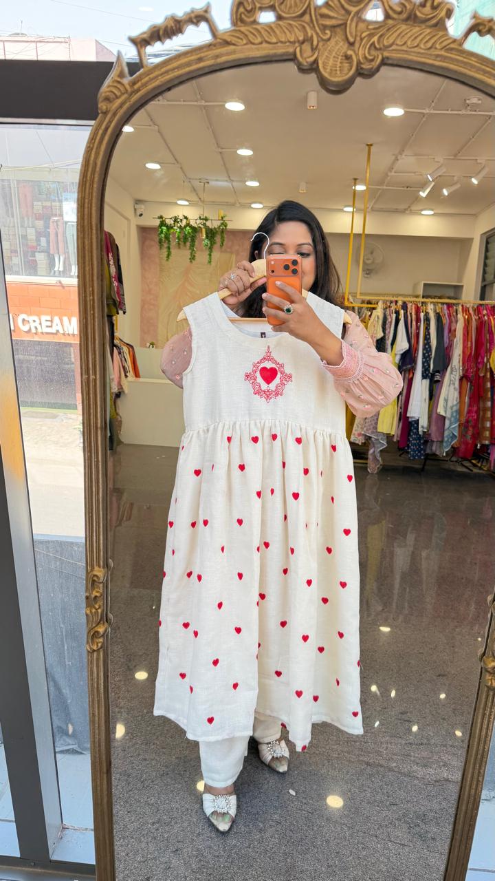 Organic cotton embroidered shrug dress. A smart piece