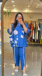 Linen cotton applique work paired with tulip pants and a bag