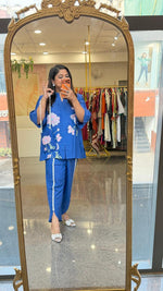 Linen cotton applique work paired with tulip pants and a bag