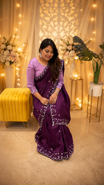 Pretty soft silk saree in wine with handwork comes with stitch blouse