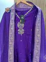 Heavy dola silk with heavy handwork and paired with brocade dupatta