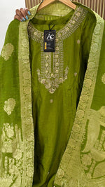 Heavy dola silk with heavy handwork and paired with brocade dupatta