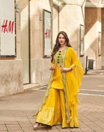 Pretty embellished silk suit paired with georgette sharara and orgenza shrug