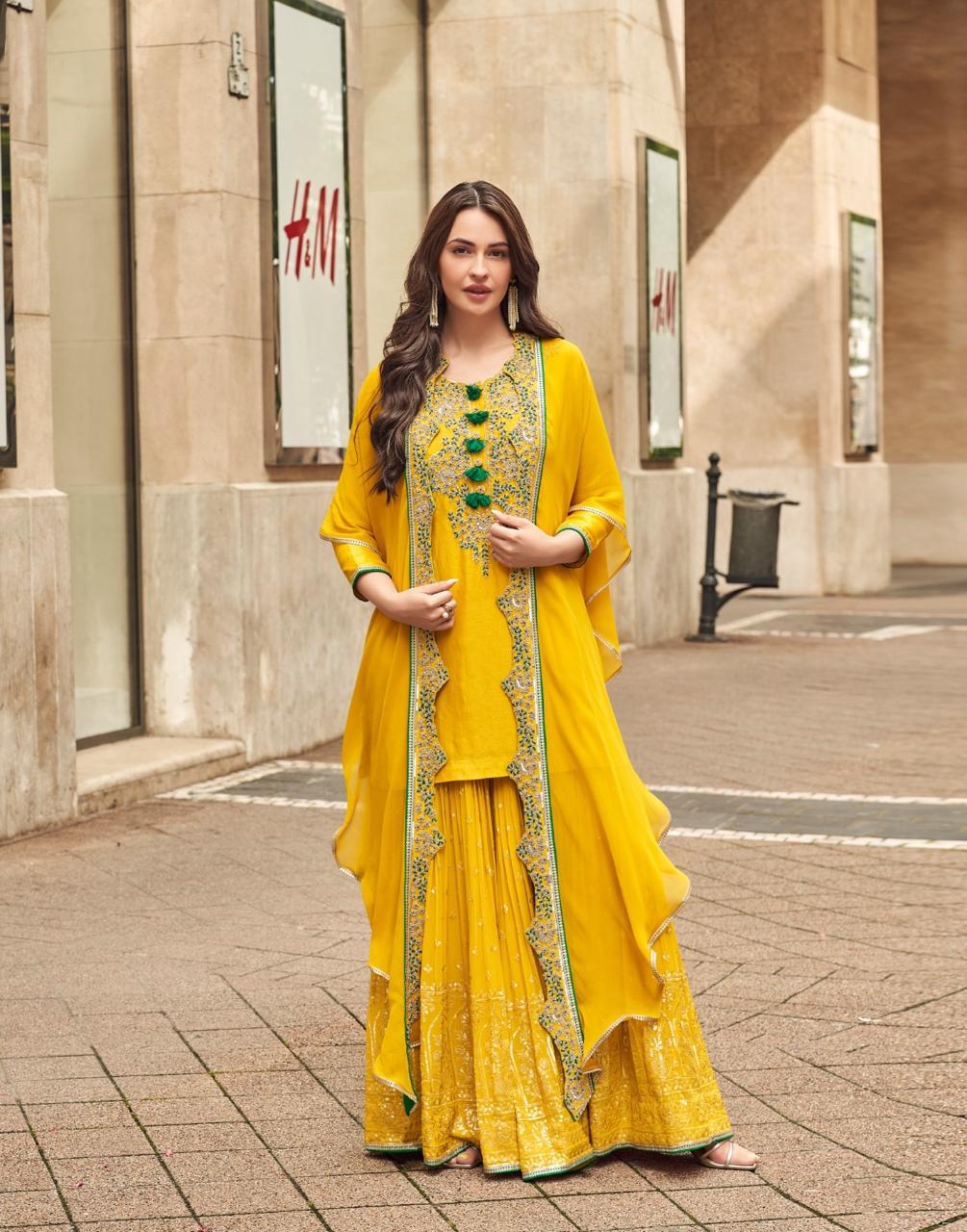 Pretty embellished silk suit paired with georgette sharara and orgenza shrug