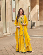 Pretty embellished silk suit paired with georgette sharara and orgenza shrug