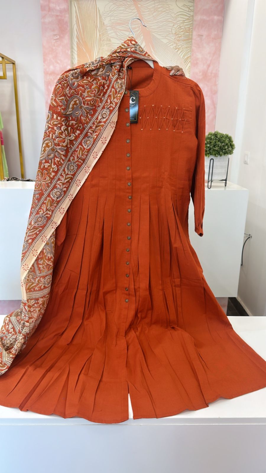 Beautiful yoke detailing suit set paired with kalamkari dupatta in rust