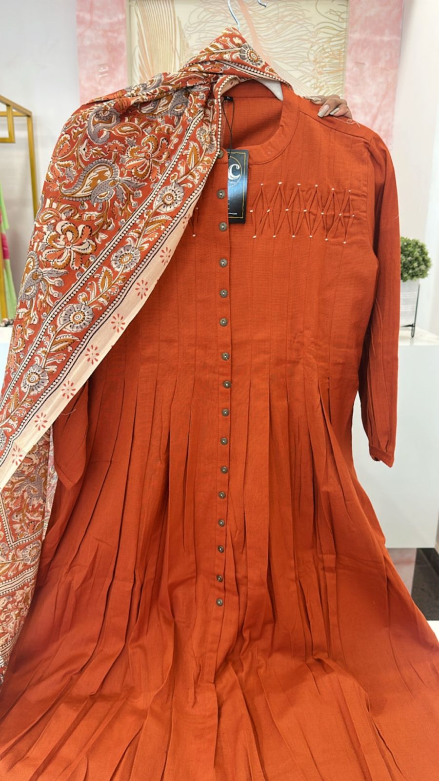 Beautiful yoke detailing suit set paired with kalamkari dupatta in rust