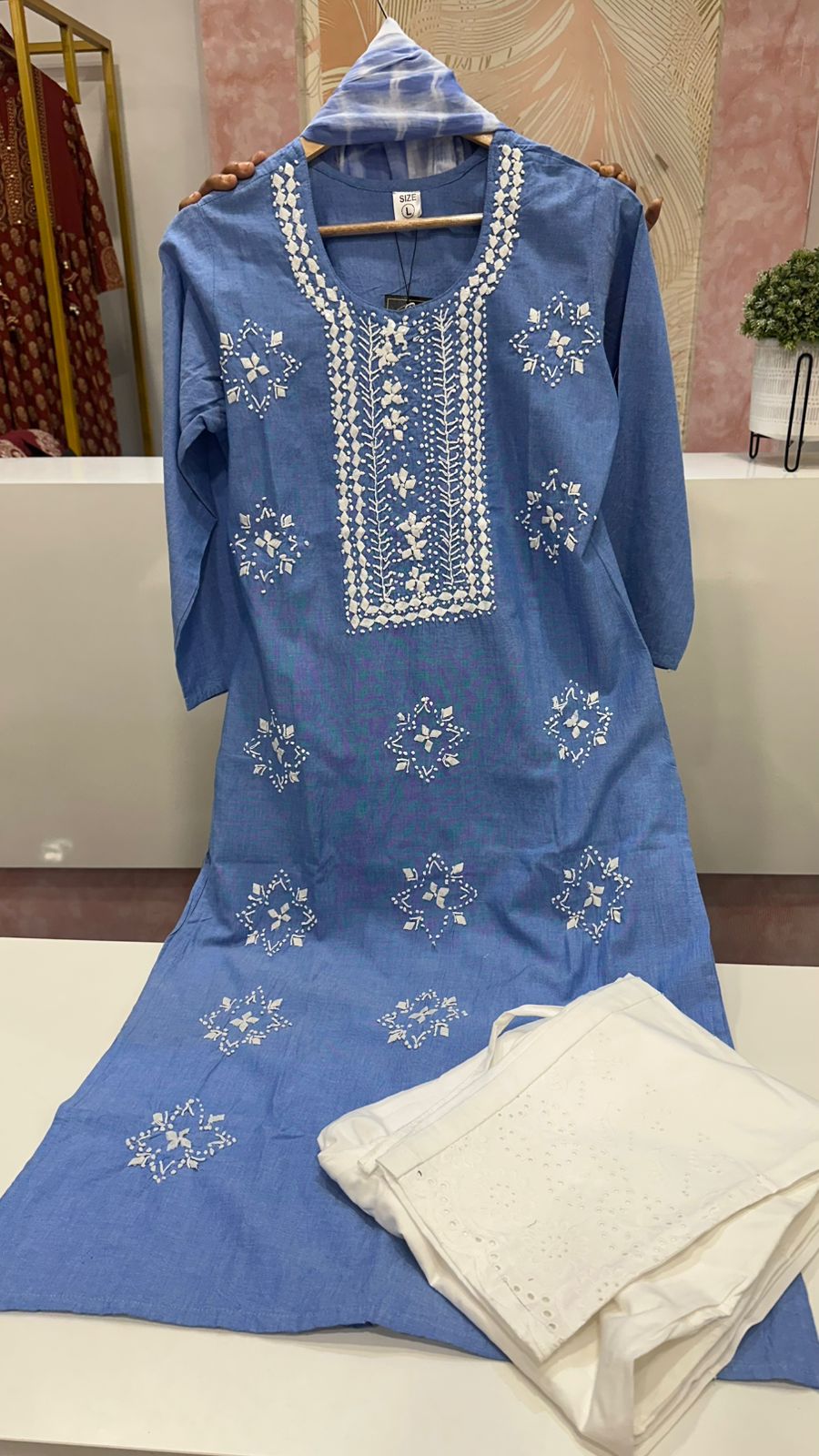 Blue embroidered cotton kurta paired with Shifli pants and shiffon