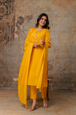 Beautiful embroidered yellow suit set paired with Mul cotton dupatta
