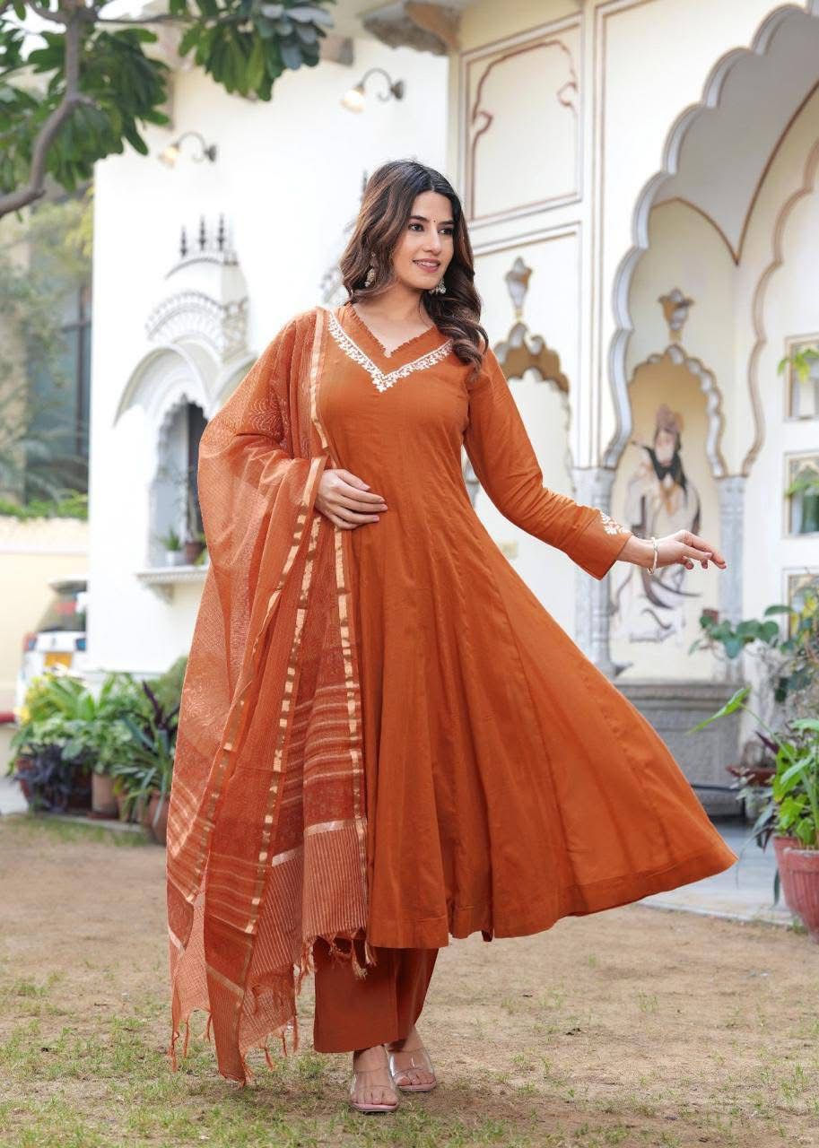 Pretty mul cotton lining suit set paired with Kota Doria dupatta in rust
