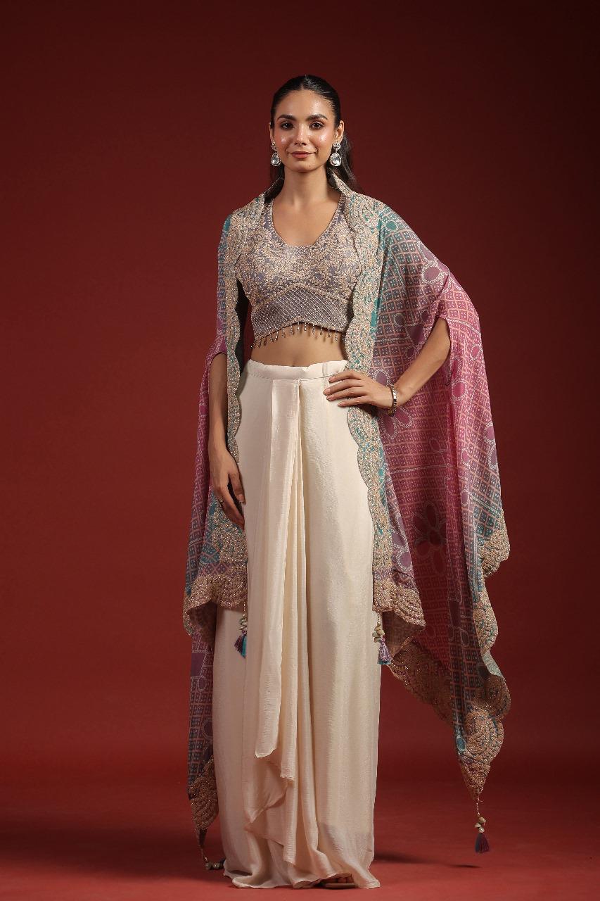 Pretty crepe heavy handwork designer party wear. Blouse, cape n pleated skirt