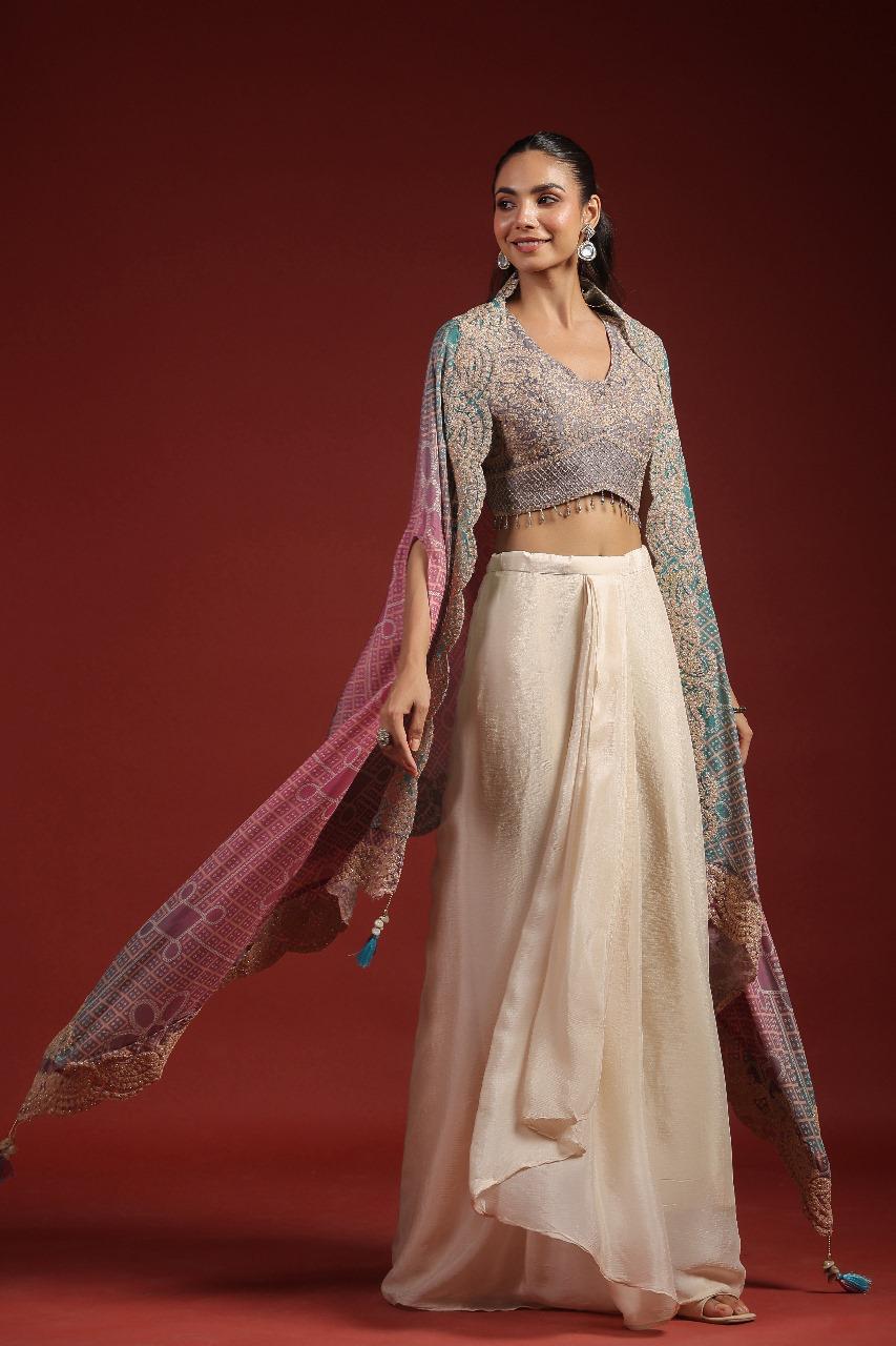 Pretty crepe heavy handwork designer party wear. Blouse, cape n pleated skirt