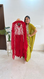 Pure crepe hand work blouse and a cape paired with a pleated skirt in red