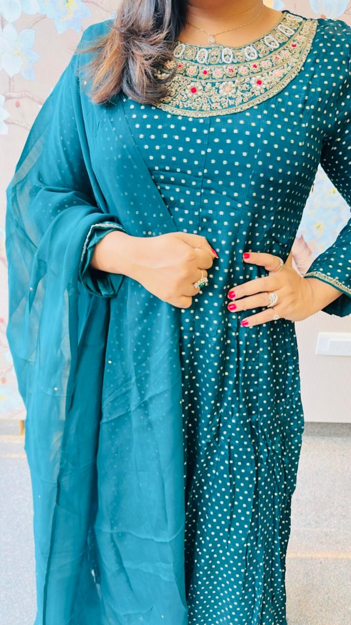 Heavy chinon tissue lining suit paired with heavy shantoon bottom and organza dupatta