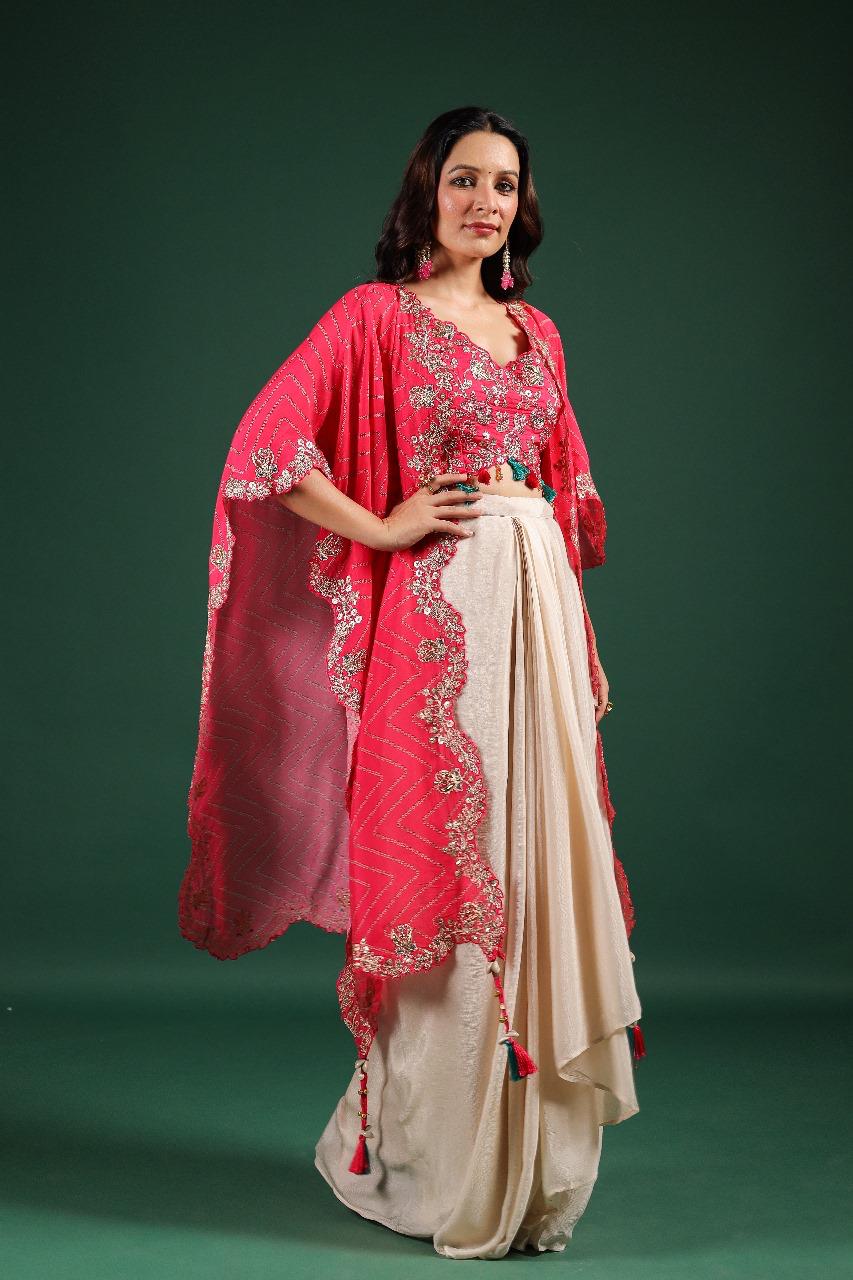 Beautiful chinon pleated skirt paired with embellished blouse and a cape (extra margin available) in pink