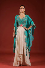 Beautiful chinon pleated skirt paired with embellished blouse and a cape (extra margin available) in blue