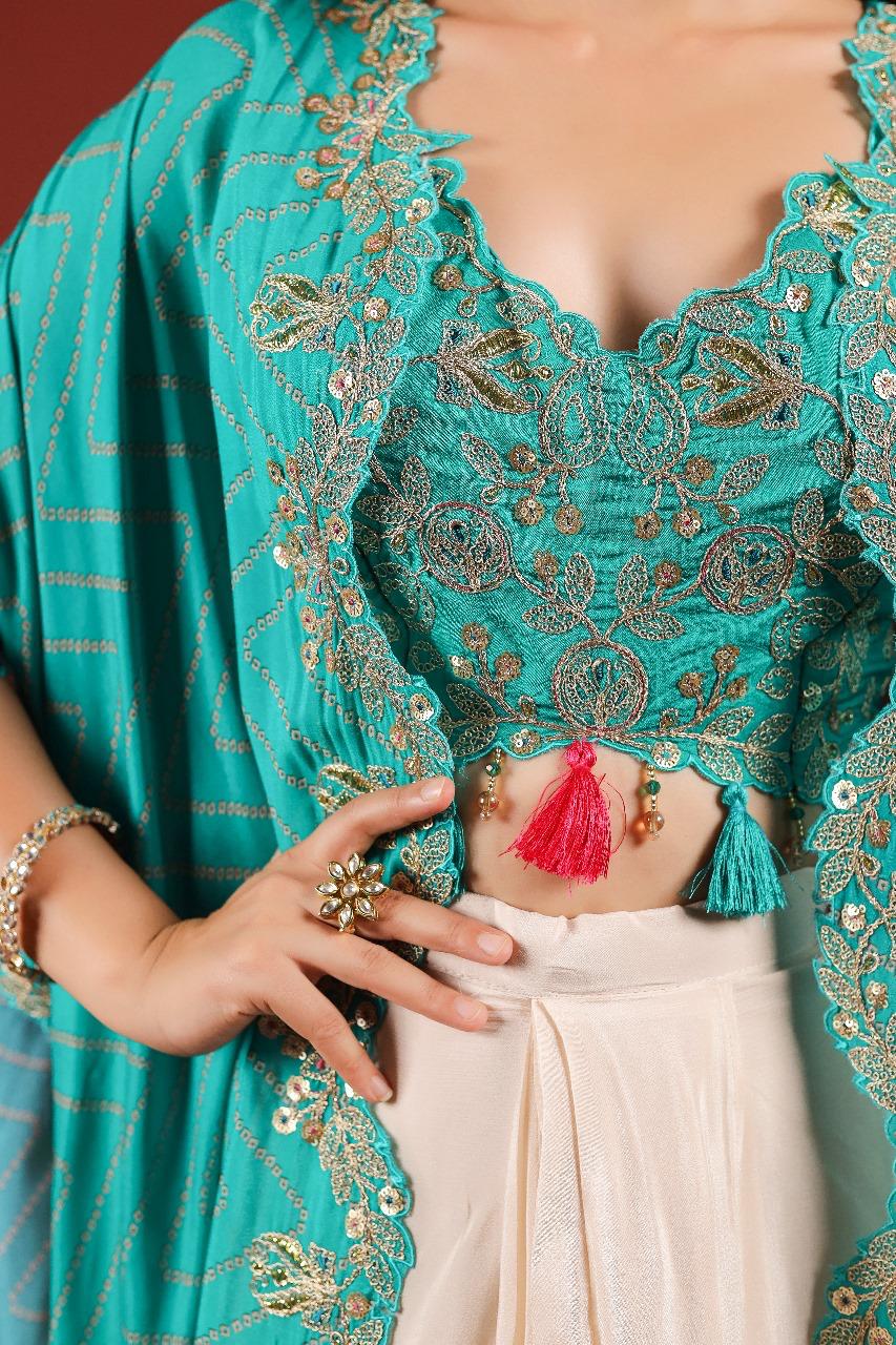 Beautiful chinon pleated skirt paired with embellished blouse and a cape (extra margin available) in blue