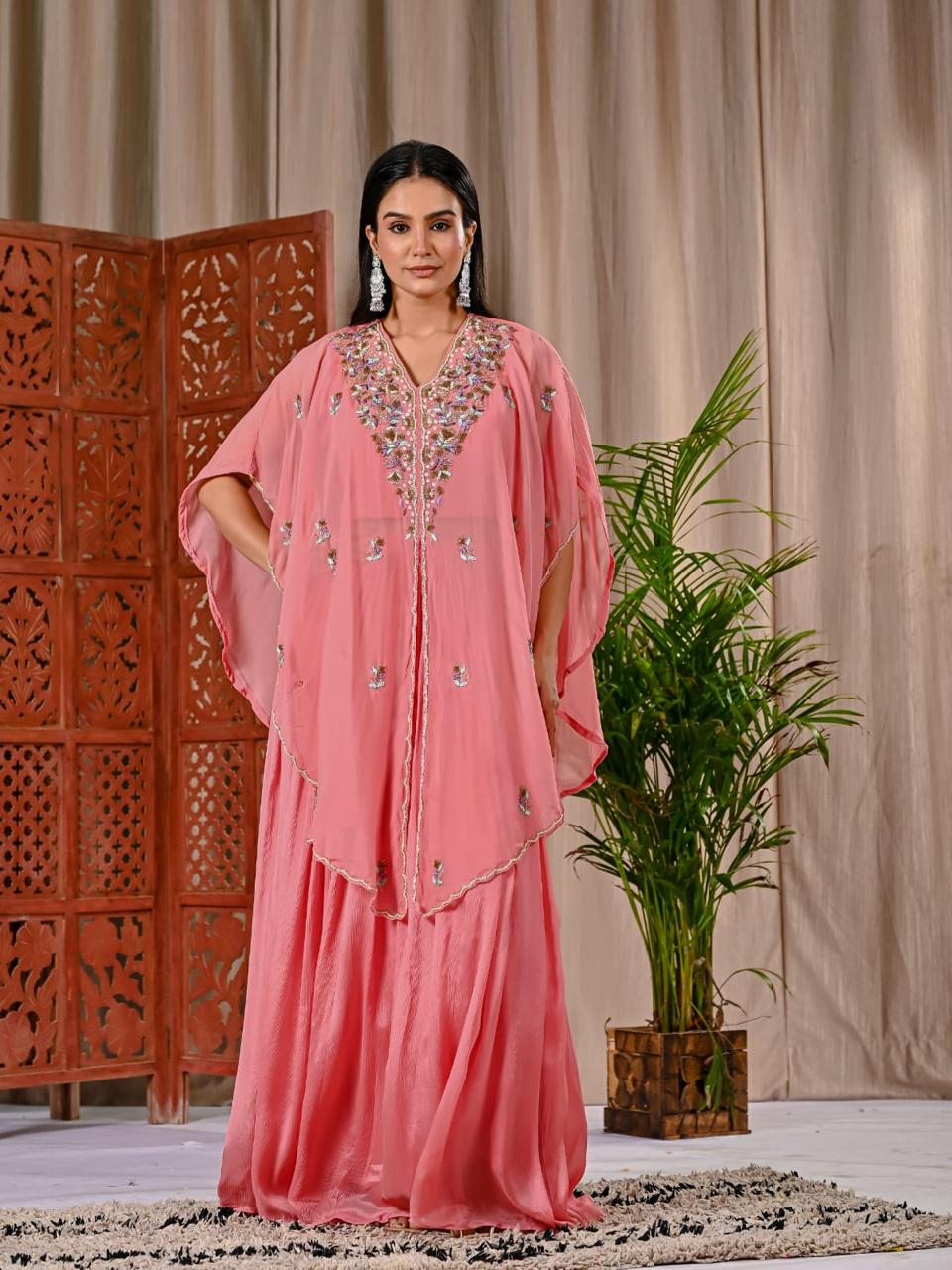 Pretty peach chinon skirt paired with a blouse and a handwork organza jacket