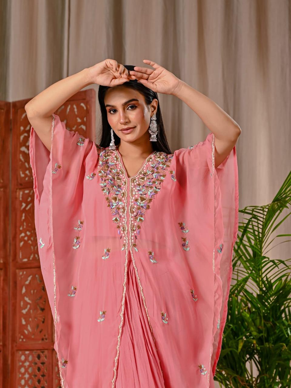 Pretty peach chinon skirt paired with a blouse and a handwork organza jacket