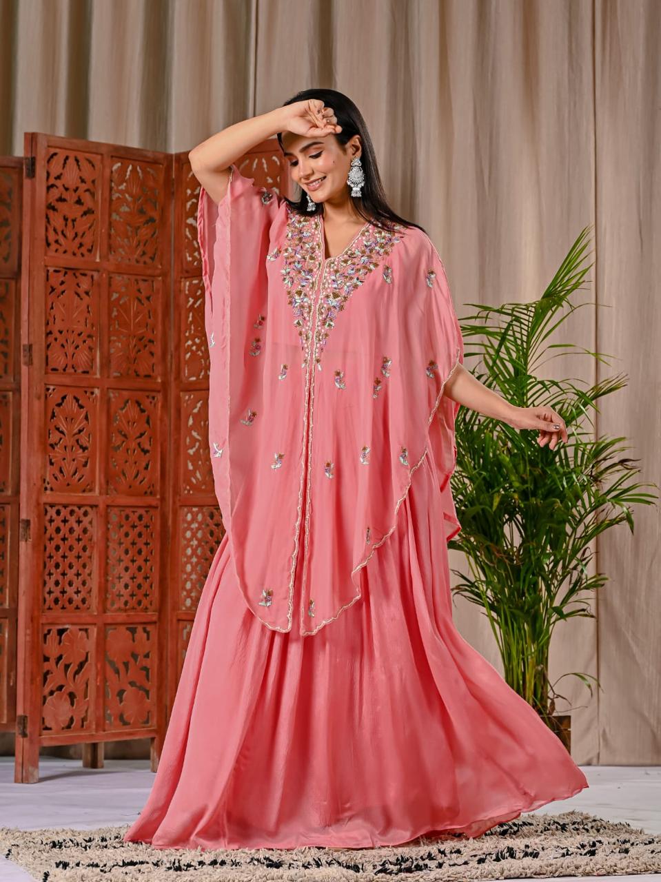 Pretty peach chinon skirt paired with a blouse and a handwork organza jacket