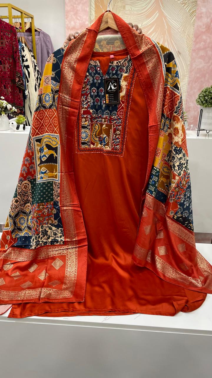 Gaji silk suit set paired with a pretty dupatta in red