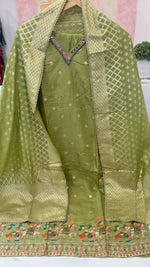 Pretty silk suit paired with Banarasi dupatta