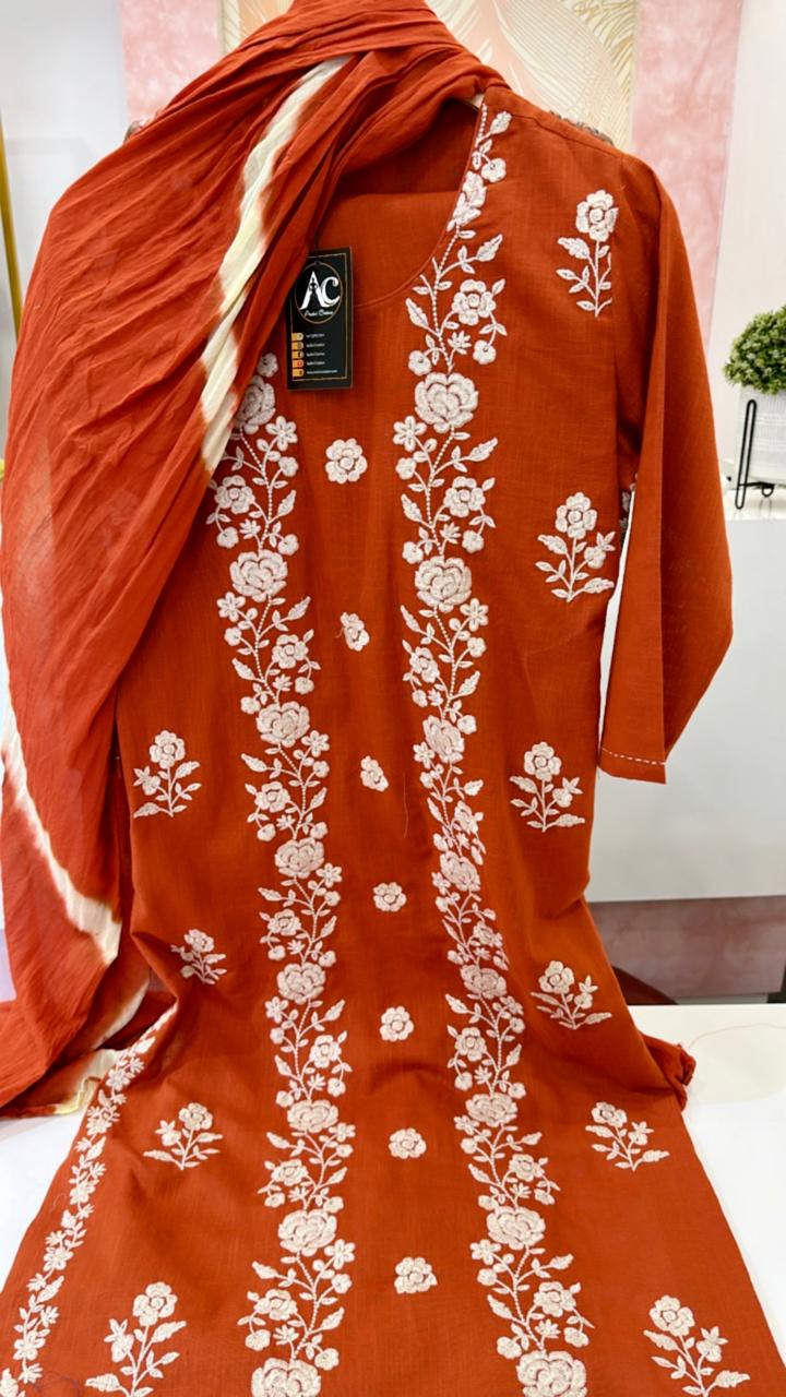 Pure cotton embroidered suit set paired with Lehariya dupatta in rust