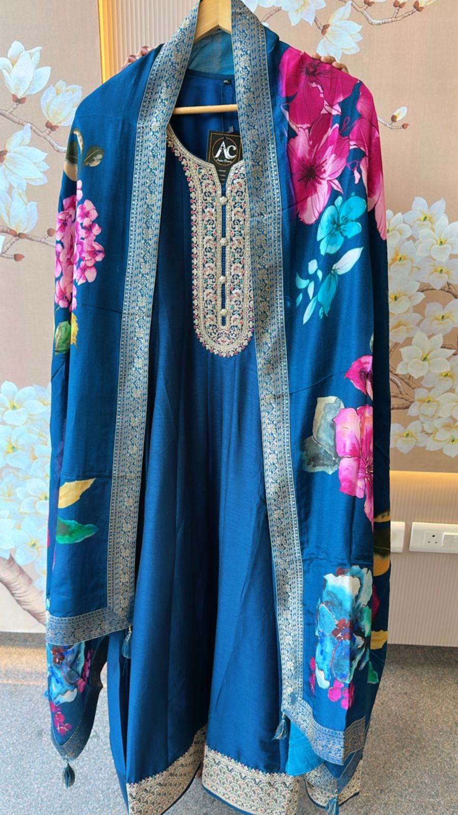 Dola silk Anarkali suit paired with floral dupatta in blue