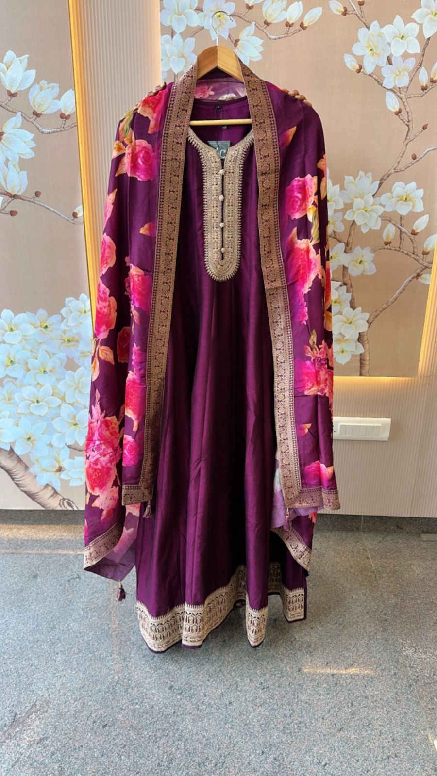 Dola silk Anarkali suit paired with floral dupatta in wine