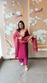 Pretty appliqué work silk suit set paired with tissue dupatta