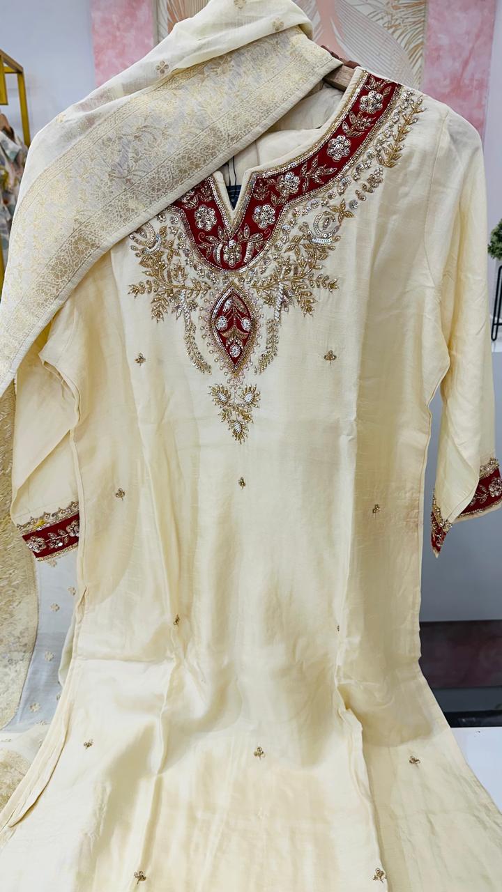 Dola silk hand work suit set paired with Banarasi dupatta in yellow