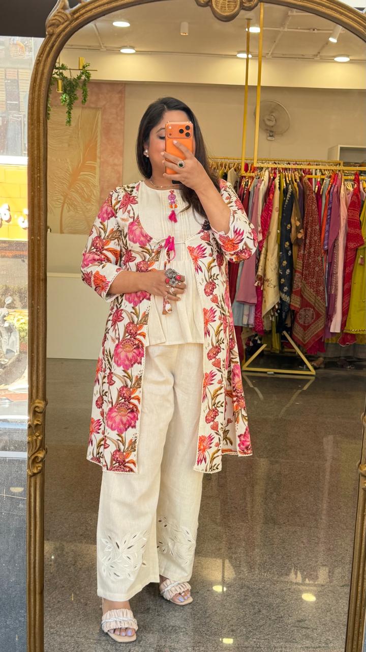 Cutwork pant paired with inner and a floral jacket in pink