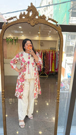 Cutwork pant paired with inner and a floral jacket in pink