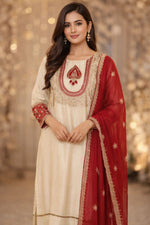 Premium silk suit with tissue detailing on the hem of kurta and intricate embroidery on sleeves and yoke paired with a pretty dupatta and silk pant