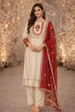Premium silk suit with tissue detailing on the hem of kurta and intricate embroidery on sleeves and yoke paired with a pretty dupatta and silk pant