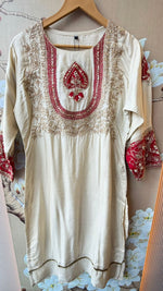 Premium silk suit with tissue detailing on the hem of kurta and intricate embroidery on sleeves and yoke paired with a pretty dupatta and silk pant