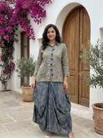 Designer cowl skirt paired with Mul silk red shirt in beige