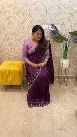 Pretty soft silk saree in wine with handwork comes with stitch blouse