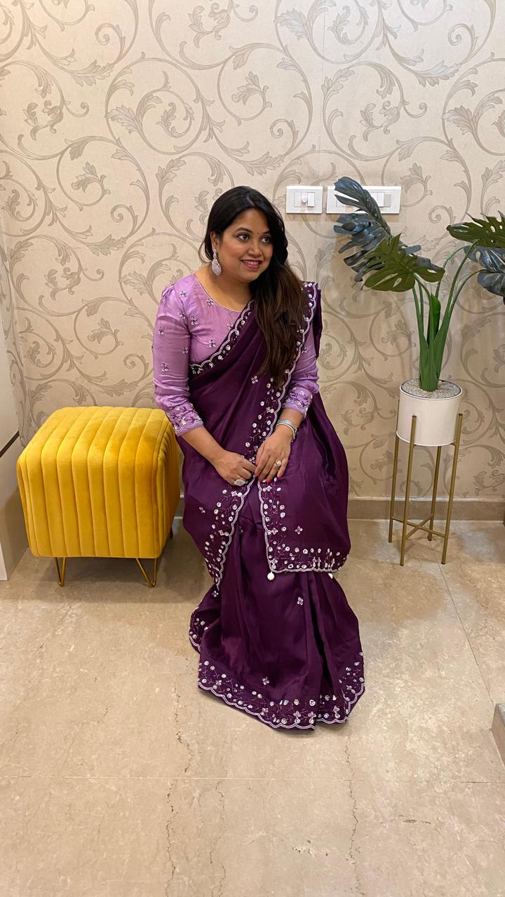 Pretty soft silk saree in wine with handwork comes with stitch blouse