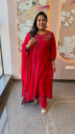 Pretty red Banarasi mulchanderi with pretty detailing and green highlightFull suit set