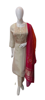 Pretty shimmer tissue suit in ivory colour paired with bandhani dupatta