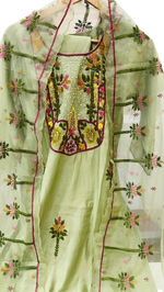 Muslin embroidered suit paired with orgenza dupatta