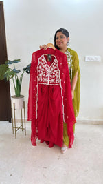 Pure crepe hand work blouse and a cape paired with a pleated skirt in red