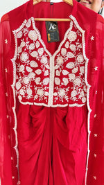 Pure crepe hand work blouse and a cape paired with a pleated skirt in red