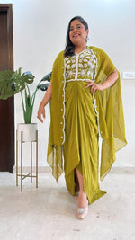 Pure crepe hand work blouse and a cape paired with a pleated skirt in green