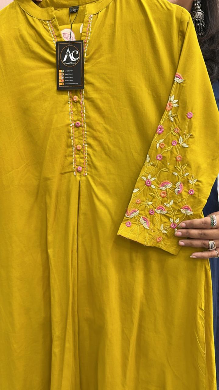Pure cotton designer back and hand embroidered full suit in yellow