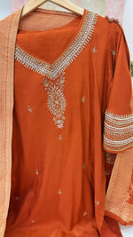 Pretty dola silk hand work suit set paired with Banarasi dupatta in orange