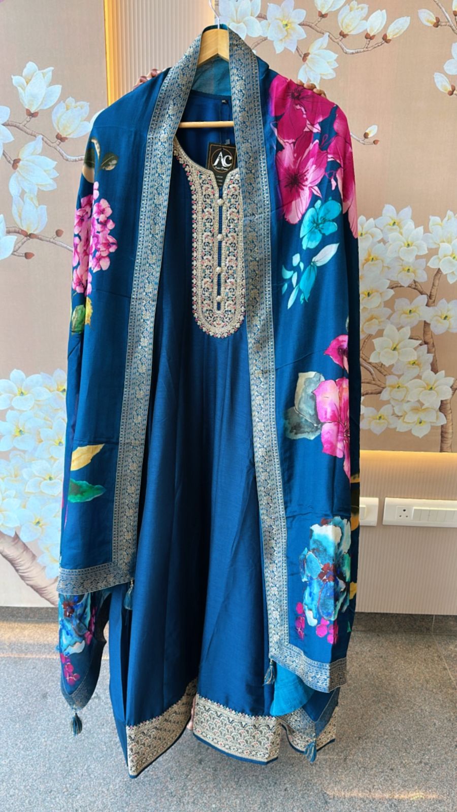 Dola silk Anarkali suit paired with floral dupatta in blue
