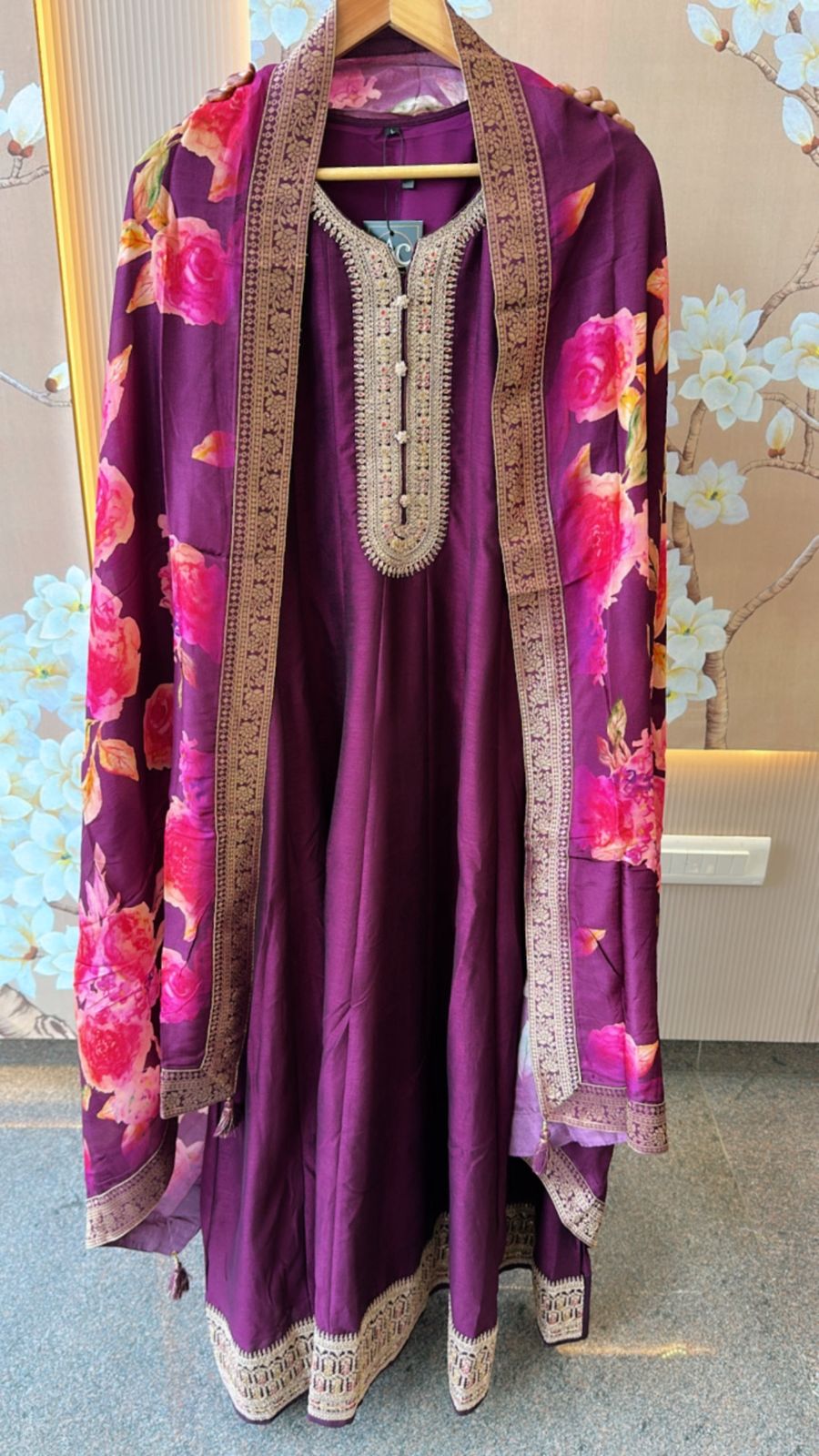 Dola silk Anarkali suit paired with floral dupatta in wine