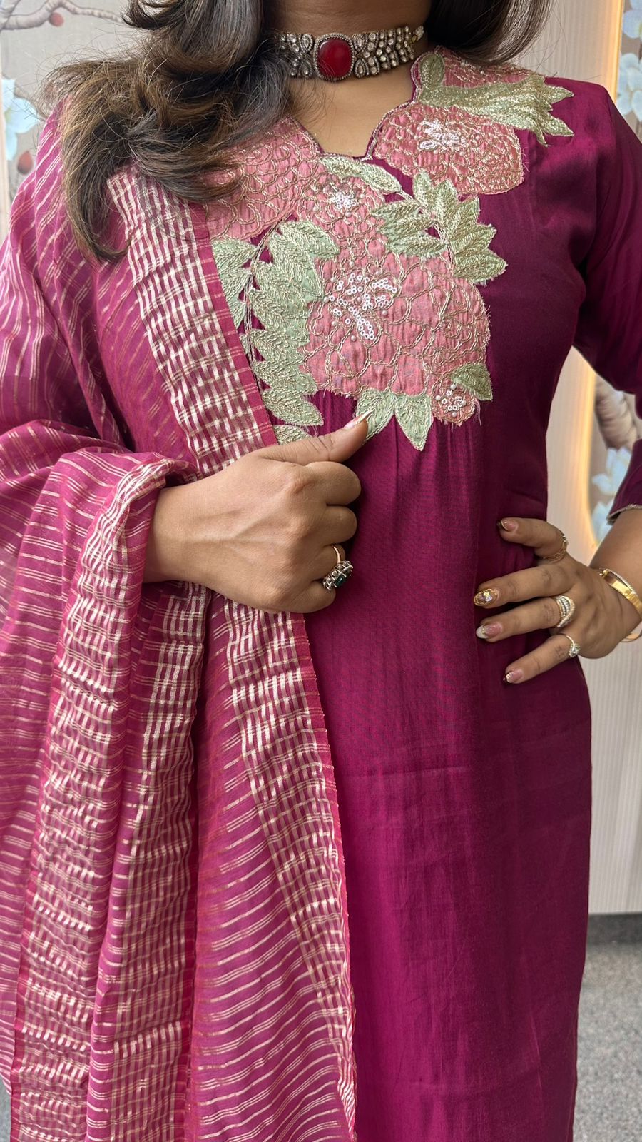 Pretty appliqué work silk suit set paired with tissue dupatta